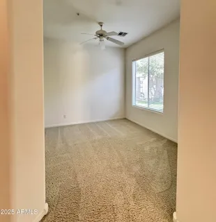 a view of an empty room with a window