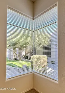 a view of kitchen with white cabinets and refrigerator