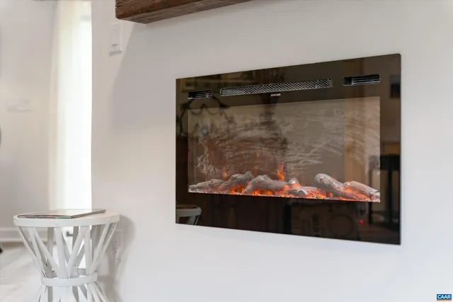 a view of a hallway with wooden floor and entryway
