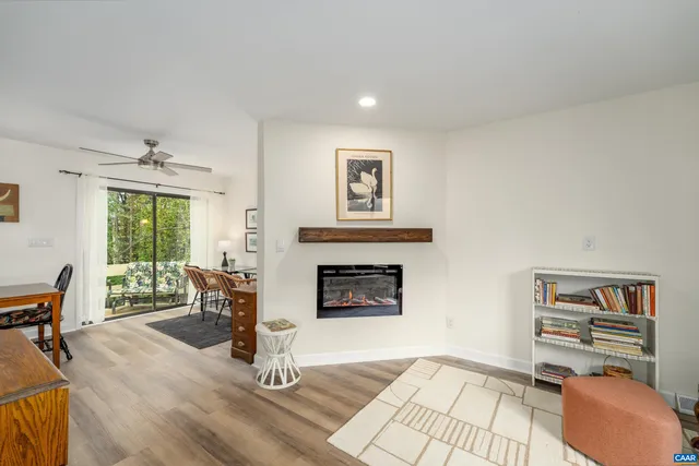 a bedroom with a bed and a flat tv screen on the dresser