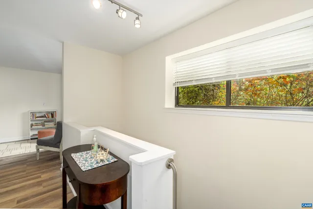 a bathroom with a sink a toilet and shower curtain