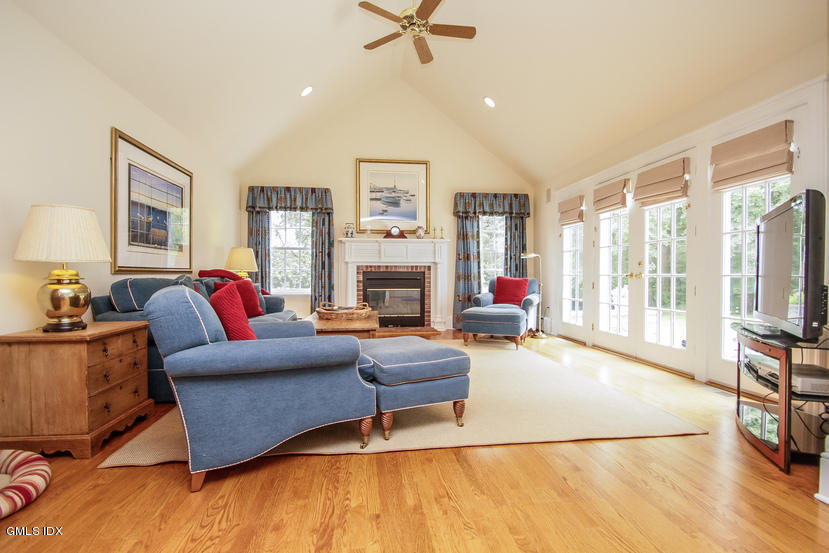 59 Indian Head Road Riverside, CT 06878 - Photo 13 of 28 a living room with furniture and a fireplace