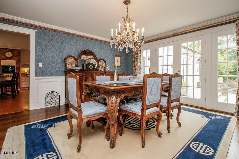 59 Indian Head Road Riverside, CT 06878 - Photo 8 of 28 a view of a dining room with furniture window and wooden floor