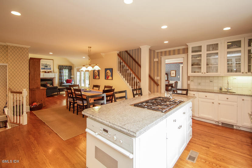 59 Indian Head Road Riverside, CT 06878 - Photo 10 of 28 a open kitchen with stainless steel appliances granite countertop a stove and a refrigerator