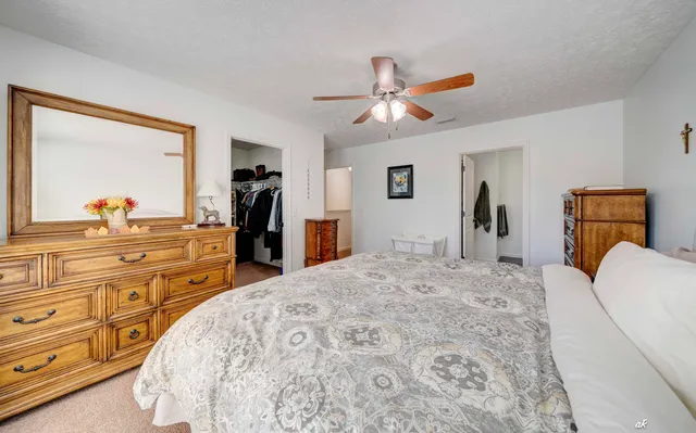 a bed room with a bed and a dresser