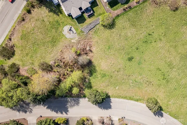 a view of a swimming pool with a yard and mountain view