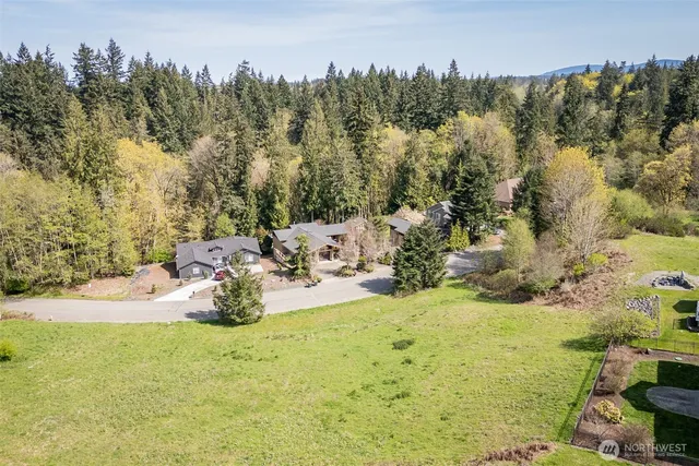 a view of a swimming pool with a yard