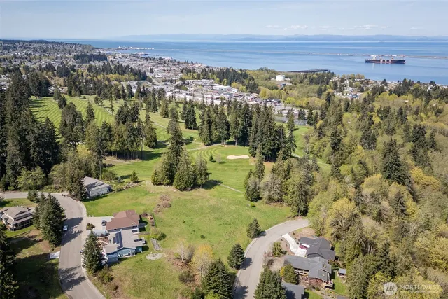an aerial view of a house with a yard