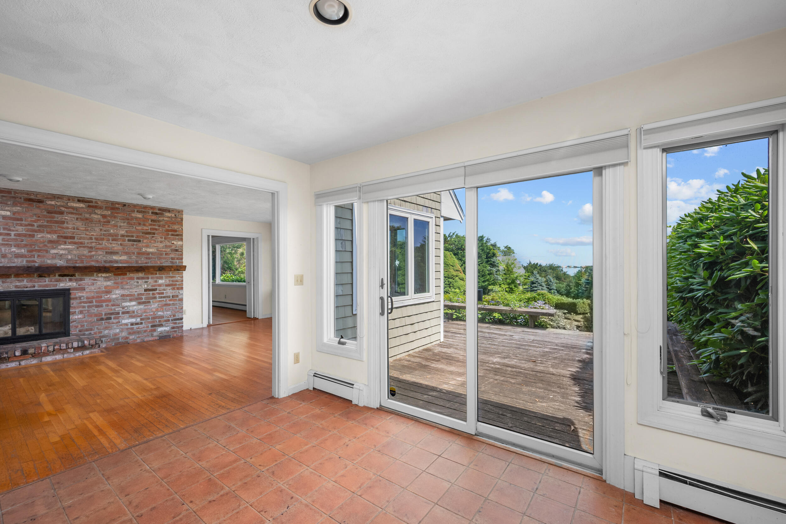 93 Harris Meadow Lane Barnstable, MA 02630 - Photo 11 of 64 a view of an empty room with glass door and balcony