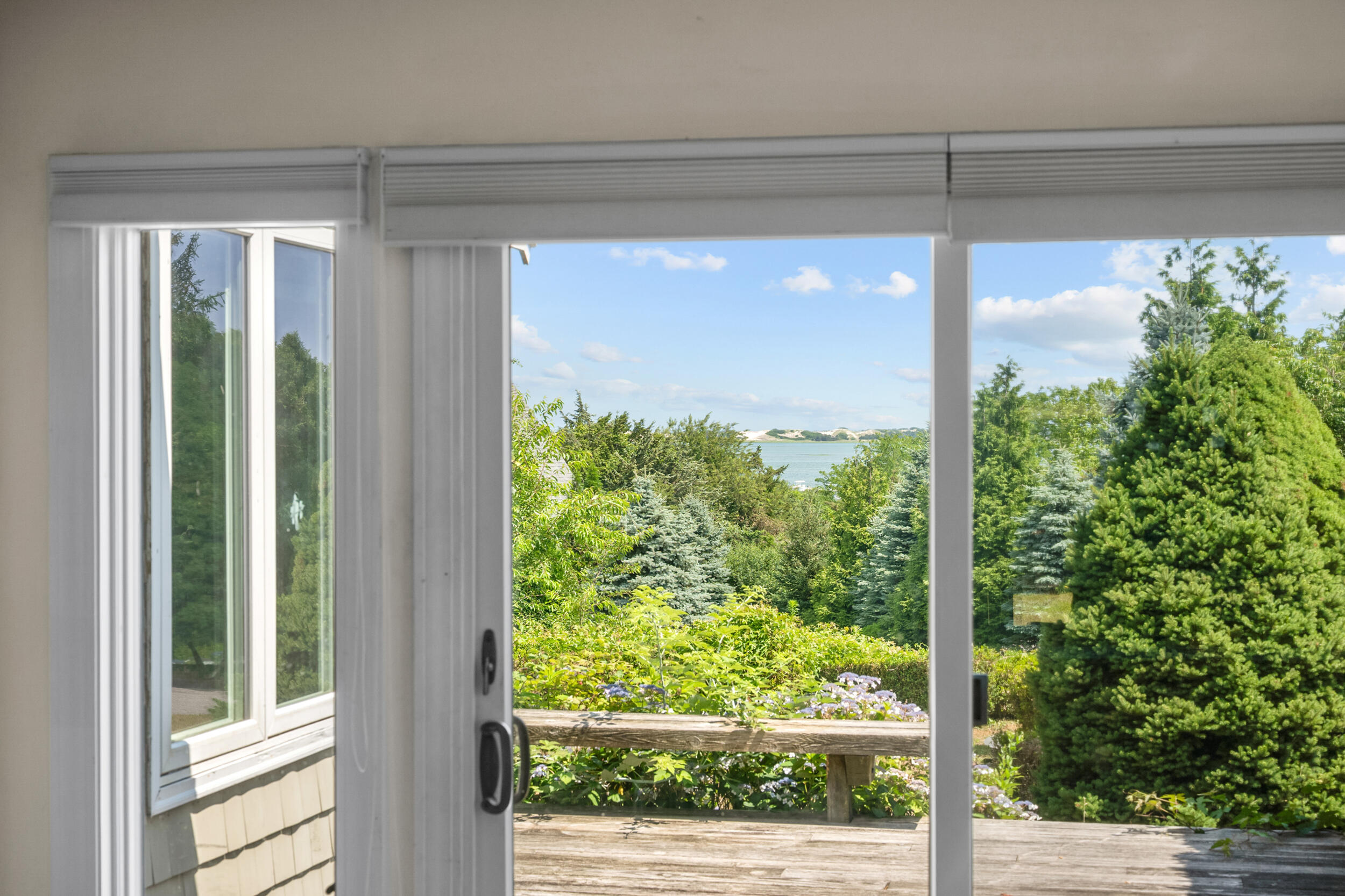 93 Harris Meadow Lane Barnstable, MA 02630 - Photo 12 of 64 a view of a room with a large window and wooden floor
