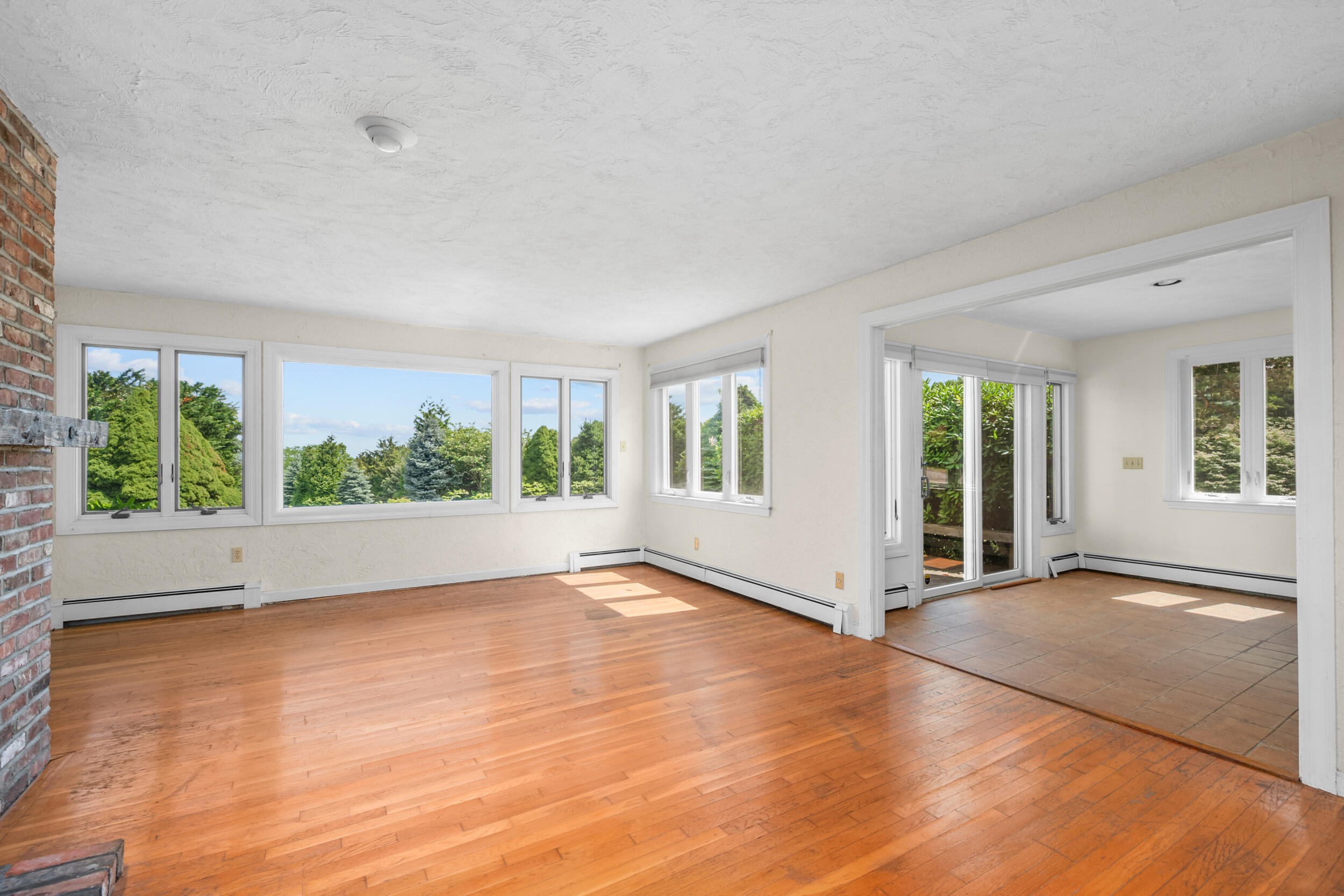 93 Harris Meadow Lane Barnstable, MA 02630 - Photo 14 of 64 a view of an empty room with wooden floor and a window