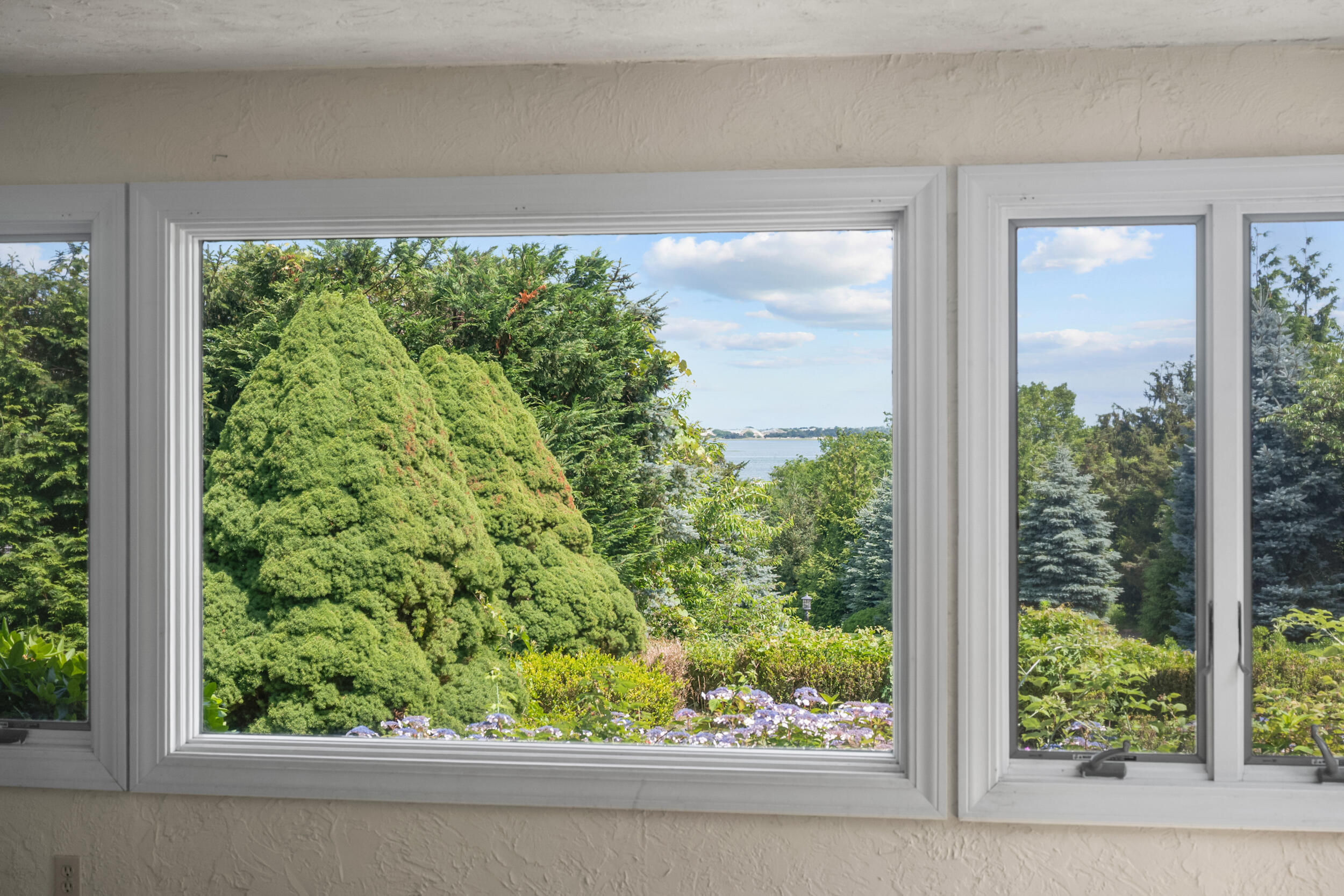 93 Harris Meadow Lane Barnstable, MA 02630 - Photo 15 of 64 a view of a garden from a window