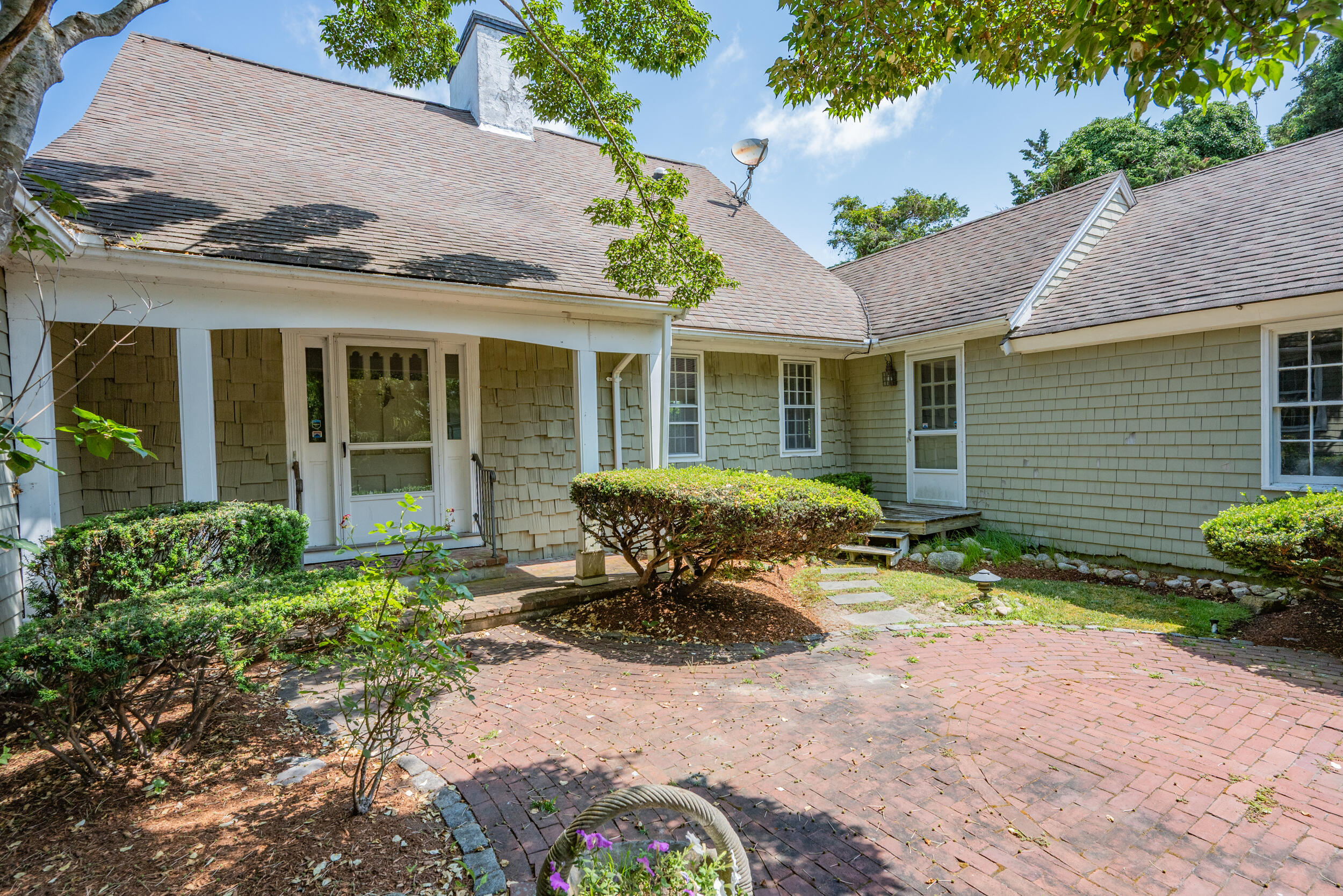 93 Harris Meadow Lane Barnstable, MA 02630 - Photo 2 of 64 a front view of a house with a yard and outdoor seating