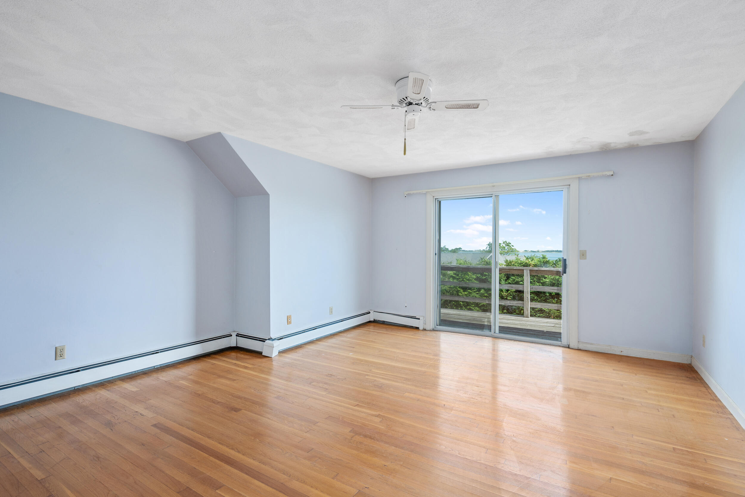 93 Harris Meadow Lane Barnstable, MA 02630 - Photo 32 of 64 a view of an empty room with wooden floor and a window