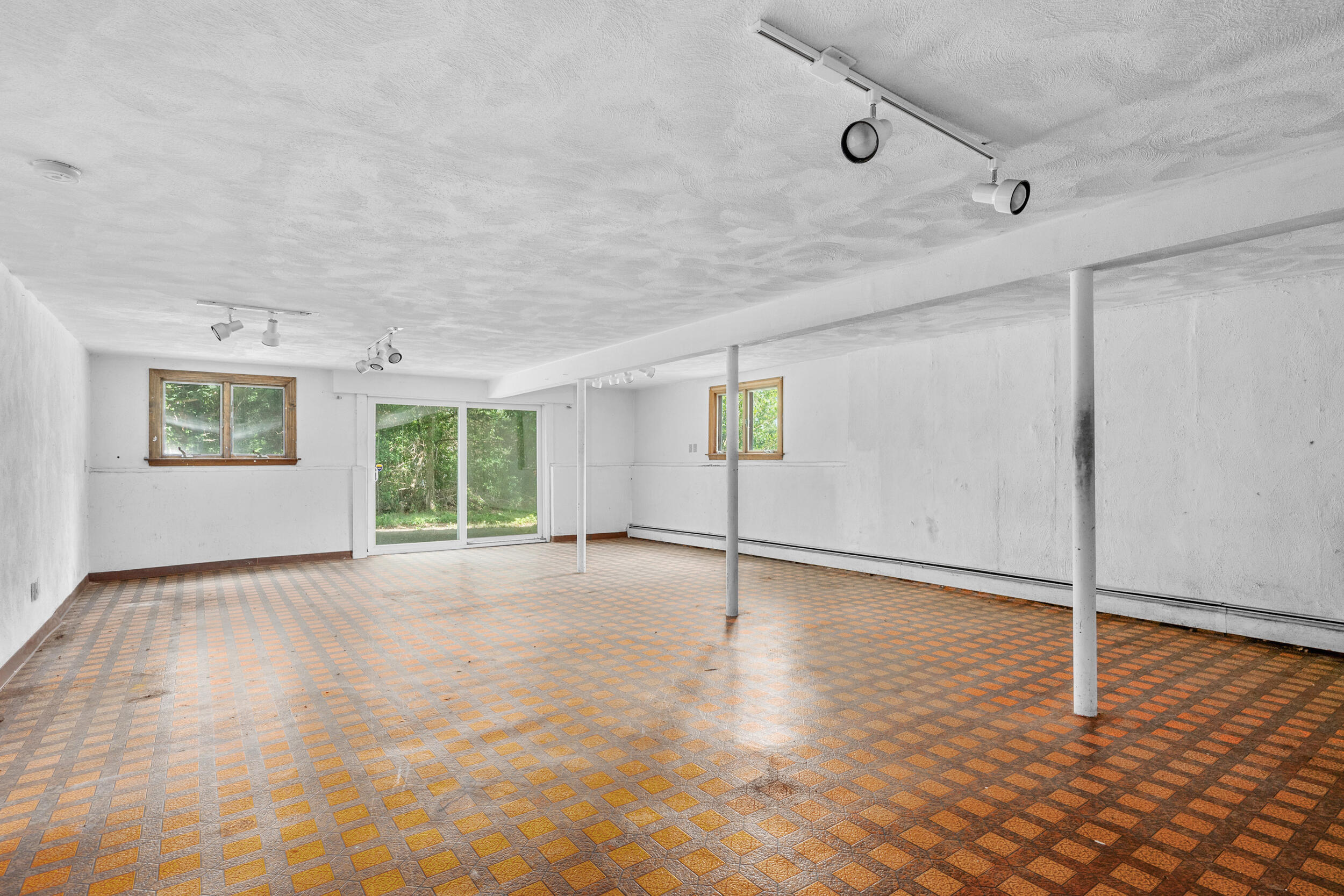 93 Harris Meadow Lane Barnstable, MA 02630 - Photo 39 of 64 a view of an empty room with a window and wooden floor