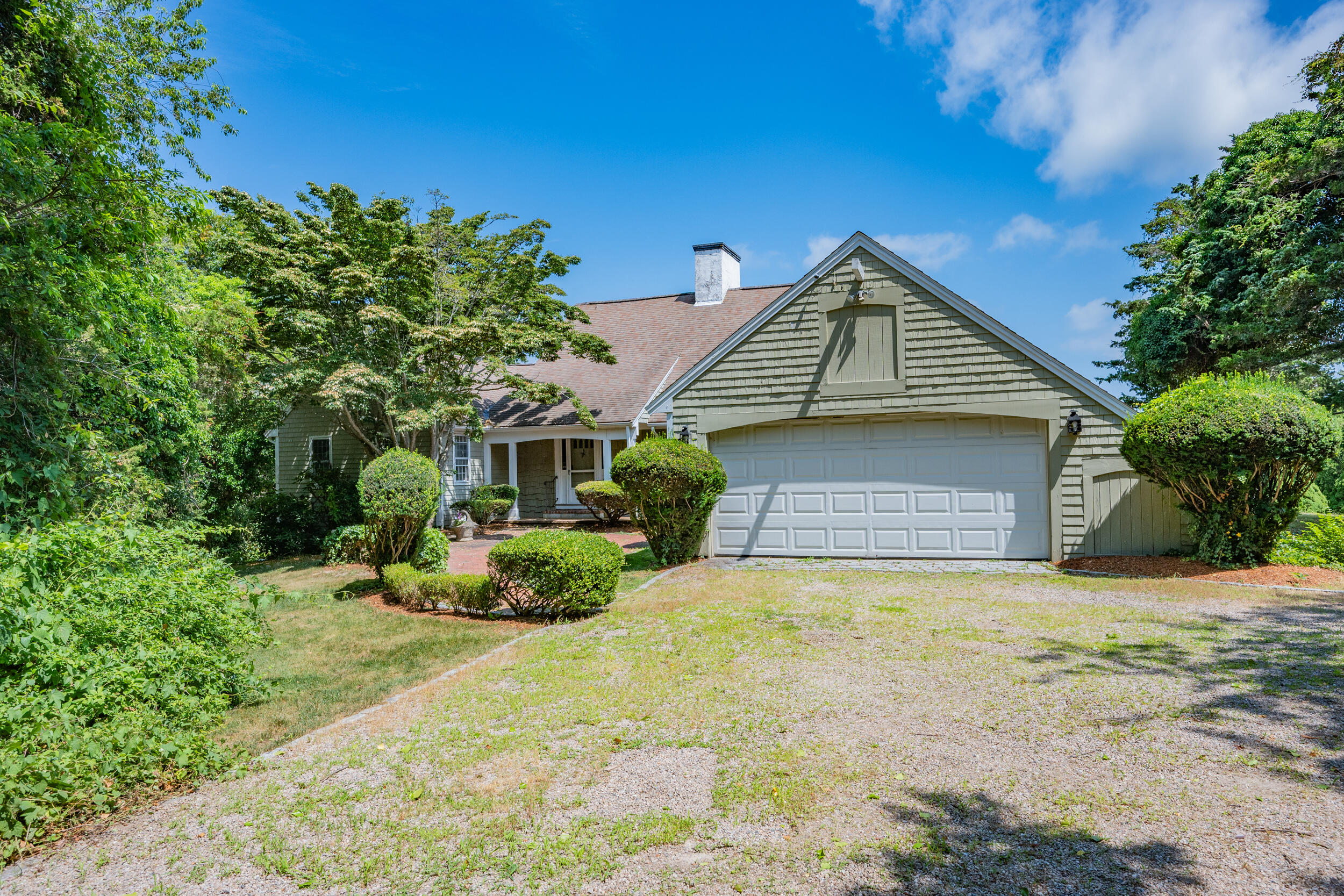 93 Harris Meadow Lane Barnstable, MA 02630 - Photo 48 of 64 a front view of a house with a yard
