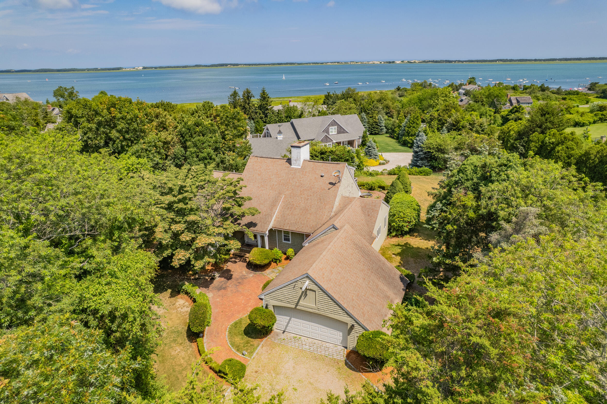 93 Harris Meadow Lane Barnstable, MA 02630 - Photo 56 of 64 an aerial view of a house with a lake view