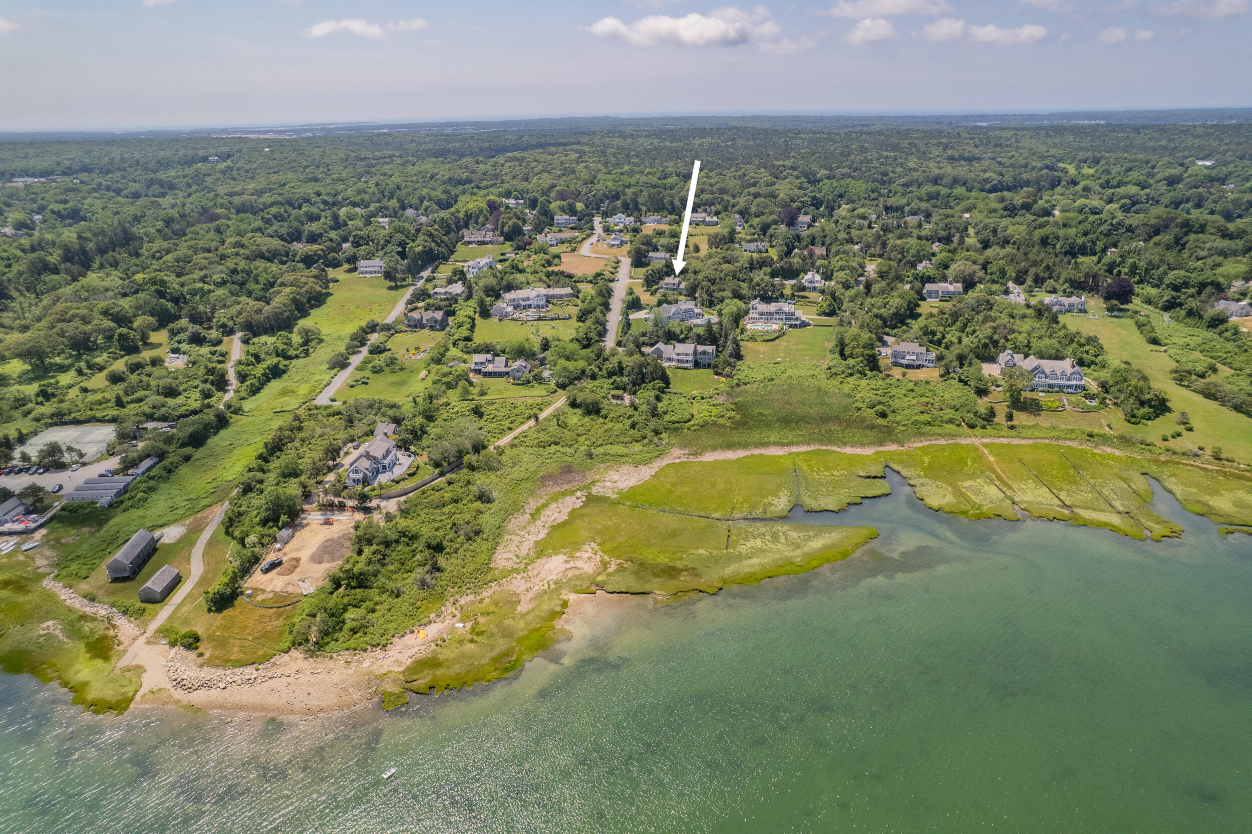 93 Harris Meadow Lane Barnstable, MA 02630 - Photo 62 of 64 an aerial view of residential houses with outdoor space and trees