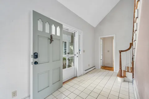 a large kitchen with stainless steel appliances granite countertop a stove a sink and a microwave