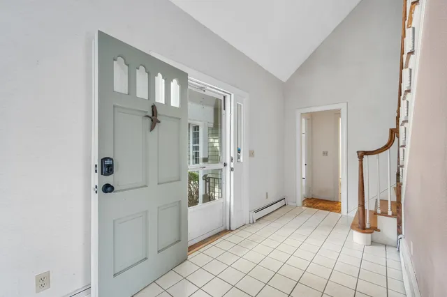 a large kitchen with stainless steel appliances granite countertop a stove a sink and a microwave