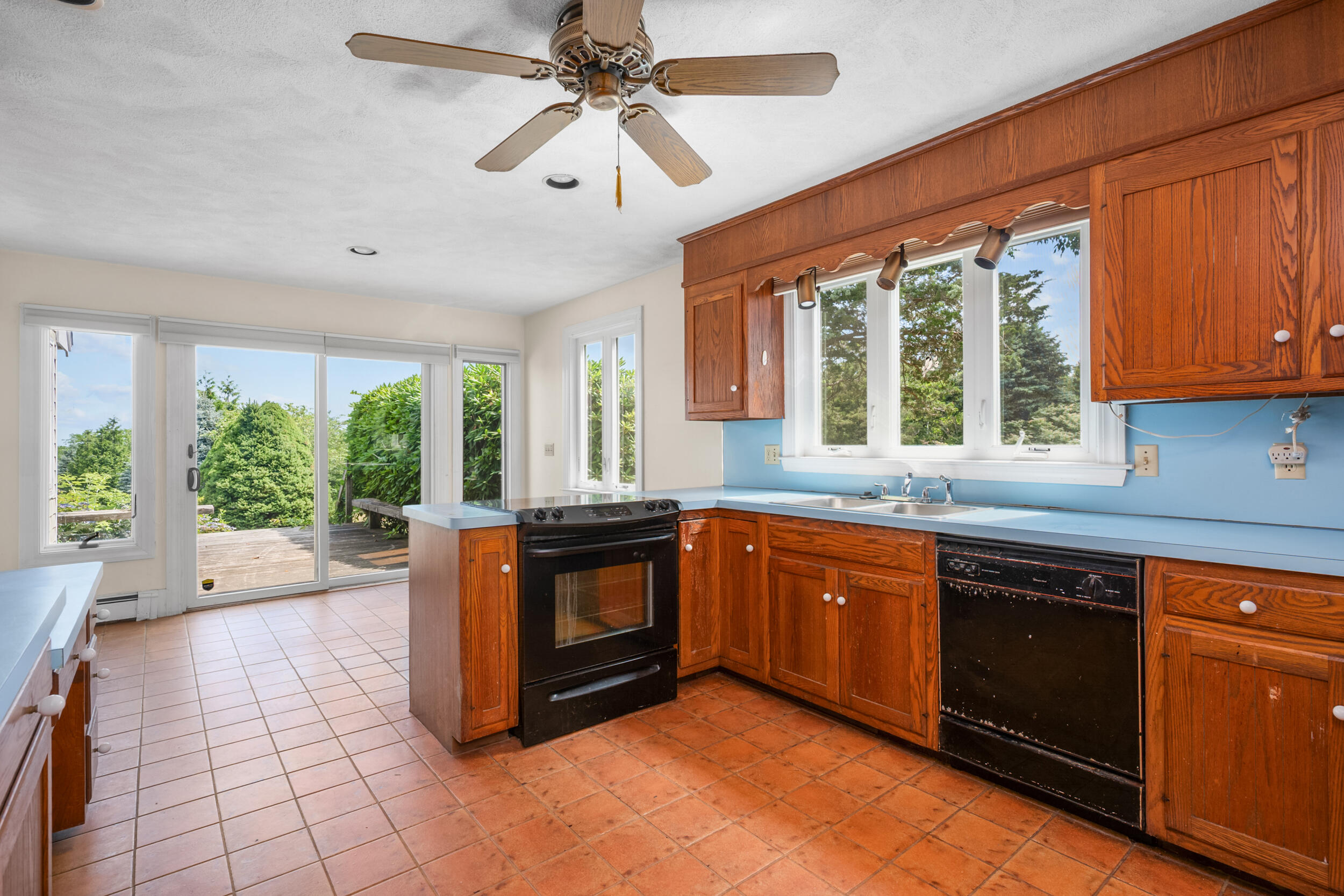 93 Harris Meadow Lane Barnstable, MA 02630 - Photo 8 of 64 a large kitchen with stainless steel appliances granite countertop a stove a sink and a microwave