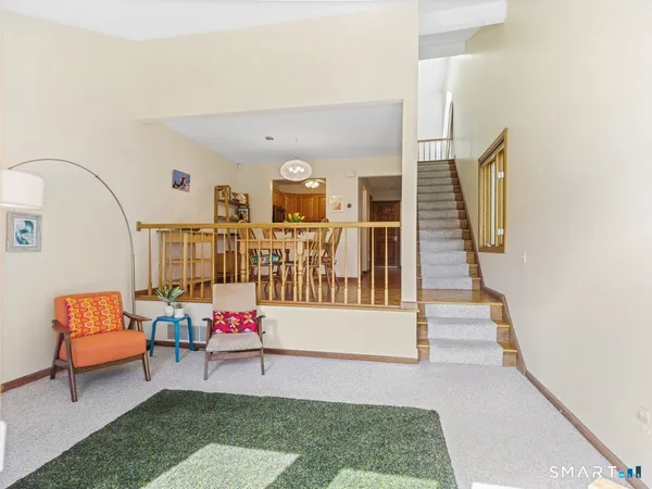 a living room with furniture and a rug