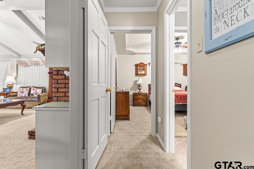 106 Cheyenne Street Gilmer, TX 75644 - Photo 11 of 48 a view of a hallway with living room and furniture