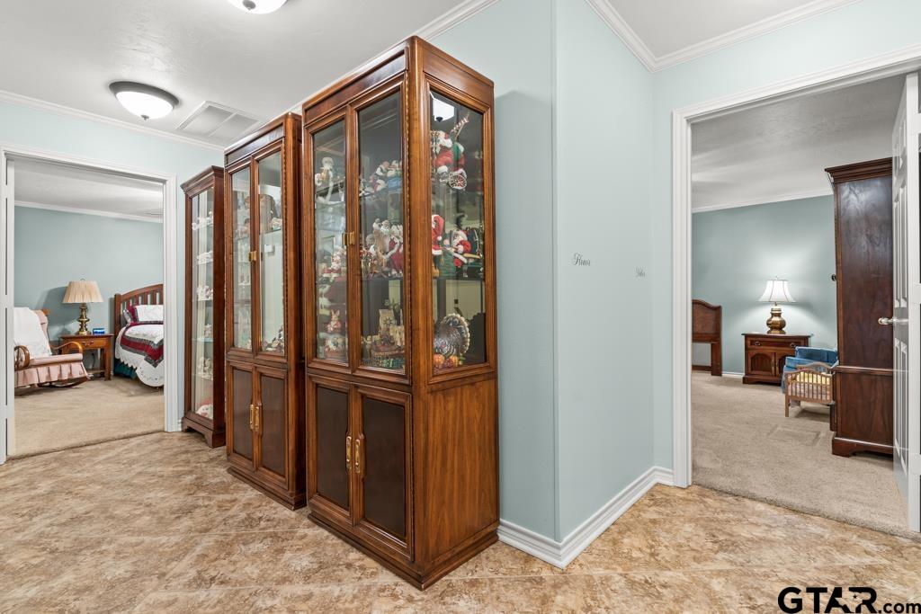 106 Cheyenne Street Gilmer, TX 75644 - Photo 23 of 48 a view of a hallway to a livingroom with furniture and an entryway