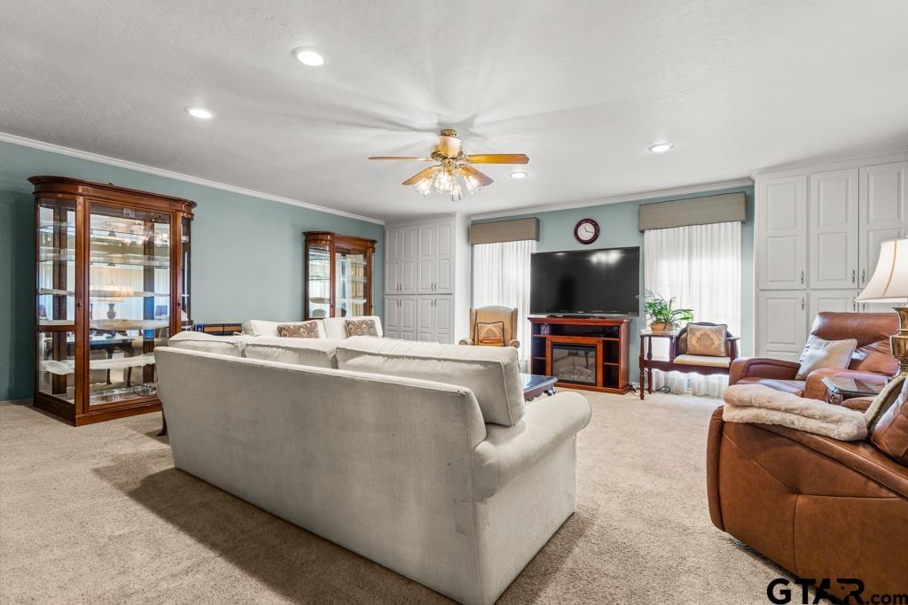 106 Cheyenne Street Gilmer, TX 75644 - Photo 25 of 48 a living room with furniture and a flat screen tv