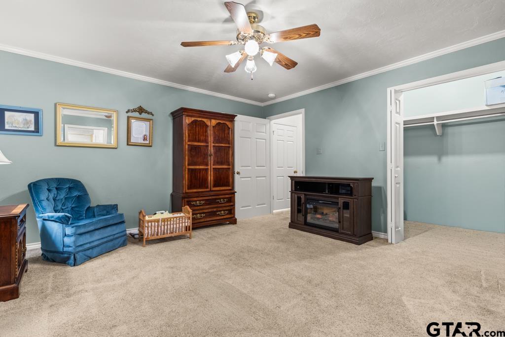 106 Cheyenne Street Gilmer, TX 75644 - Photo 29 of 48 a living room with furniture and a fireplace