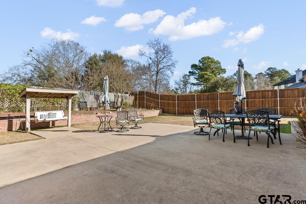 106 Cheyenne Street Gilmer, TX 75644 - Photo 37 of 48 a view of a outdoor space with furniture and garden view