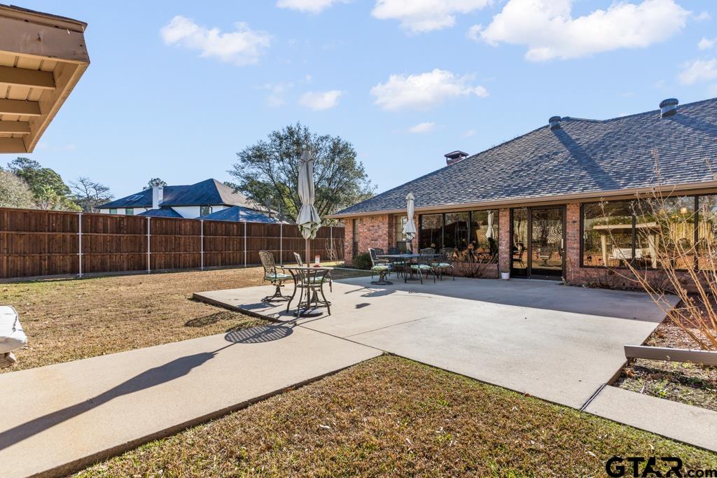 106 Cheyenne Street Gilmer, TX 75644 - Photo 38 of 48 a view of a house with backyard and sitting area