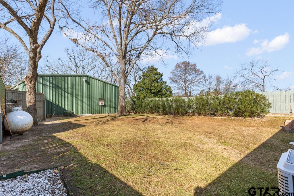 106 Cheyenne Street Gilmer, TX 75644 - Photo 39 of 48 a view of a backyard of a house