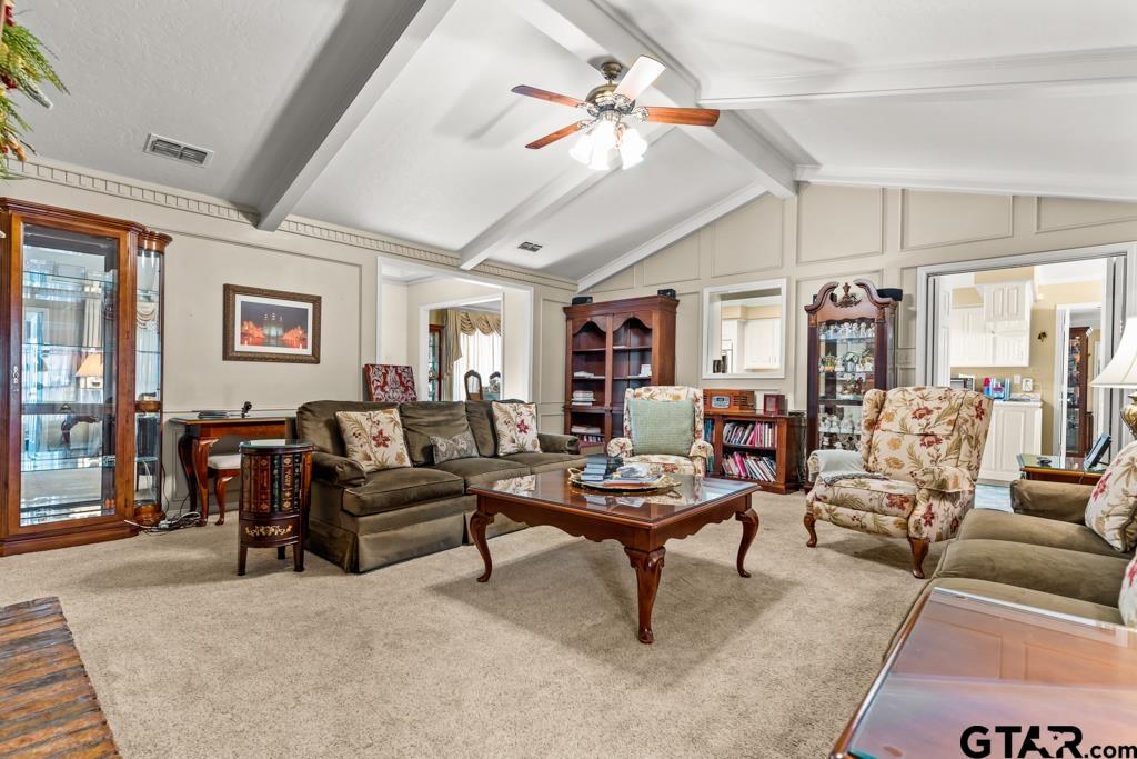 106 Cheyenne Street Gilmer, TX 75644 - Photo 4 of 48 a living room with furniture and a chandelier