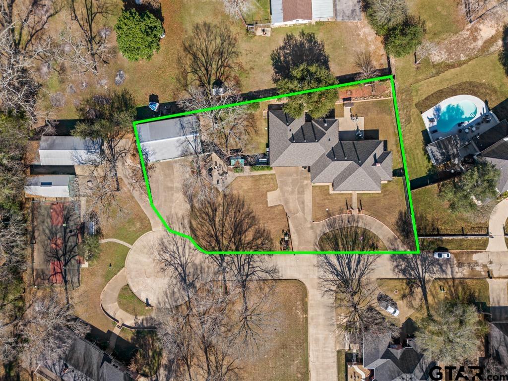 106 Cheyenne Street Gilmer, TX 75644 - Photo 47 of 48 an aerial view of a house with a garden and plants