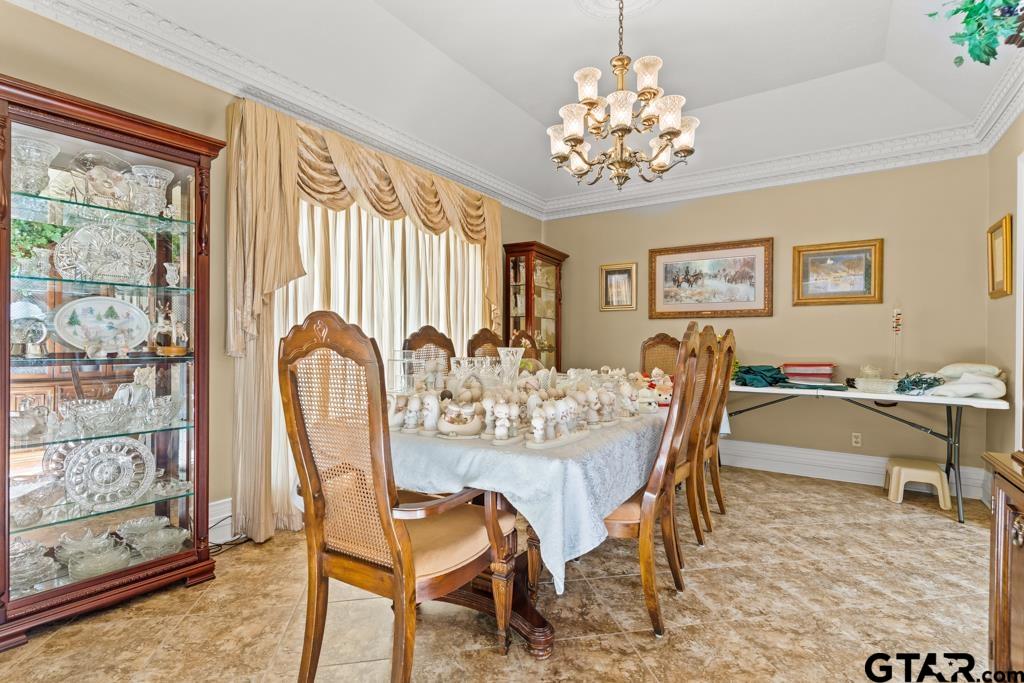 106 Cheyenne Street Gilmer, TX 75644 - Photo 6 of 48 a view of a dining room with furniture window and wooden floor