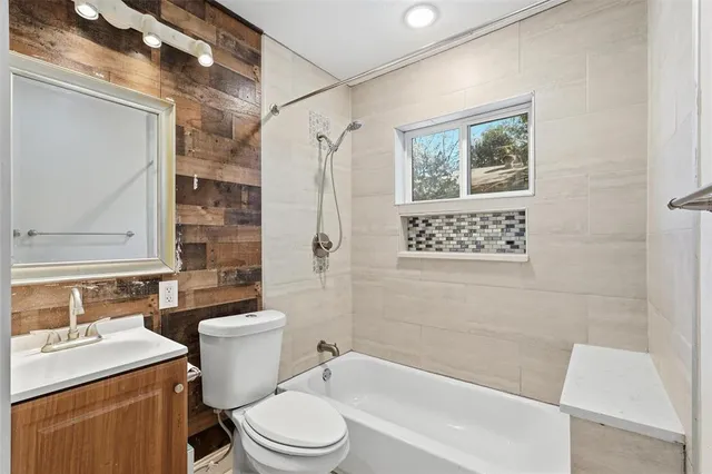 a bathroom with a toilet a sink and a bathtub