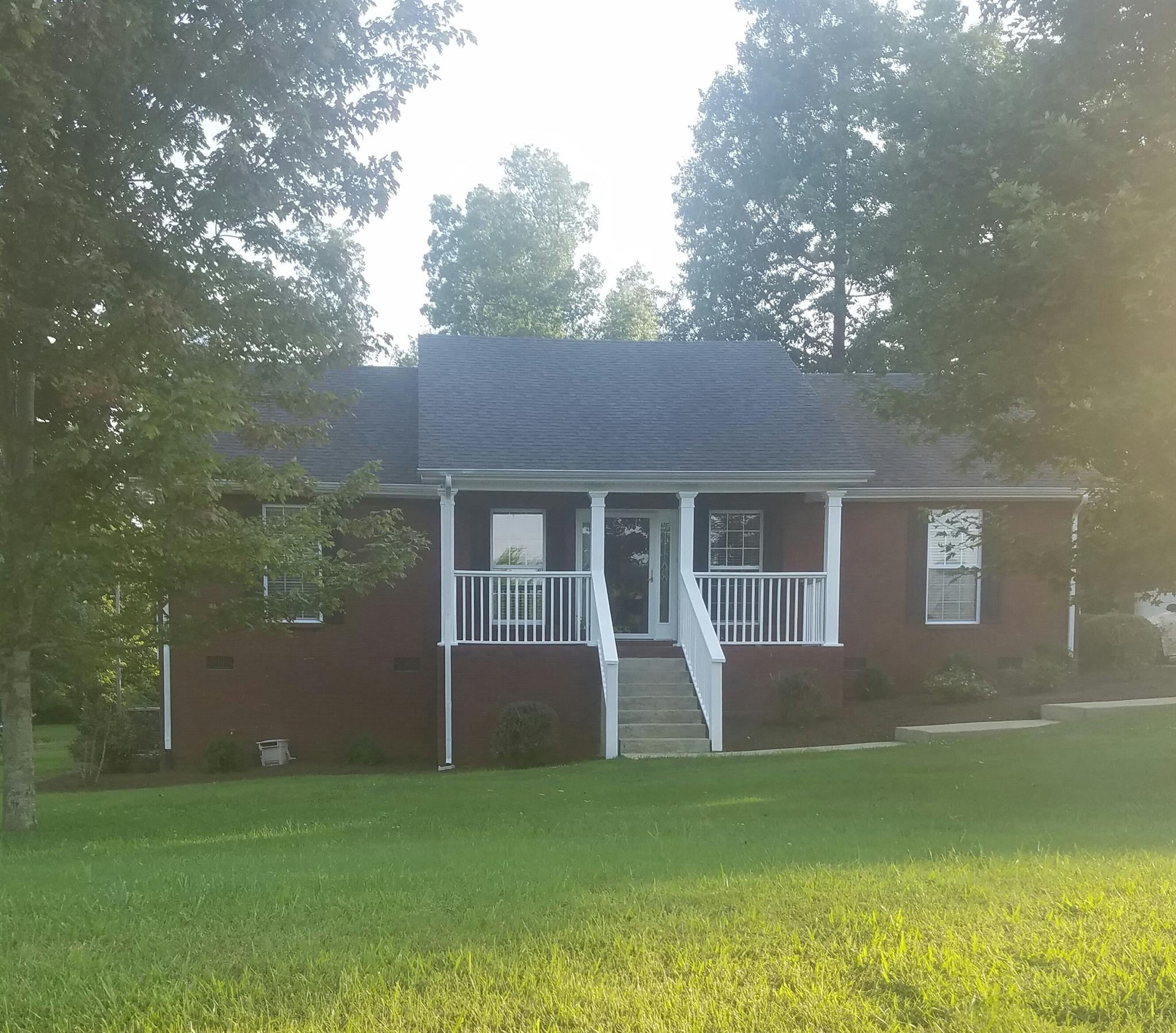 142 Switchboard Road Portland, TN 37148 - Photo 1 of 29 a view of a house with a backyard