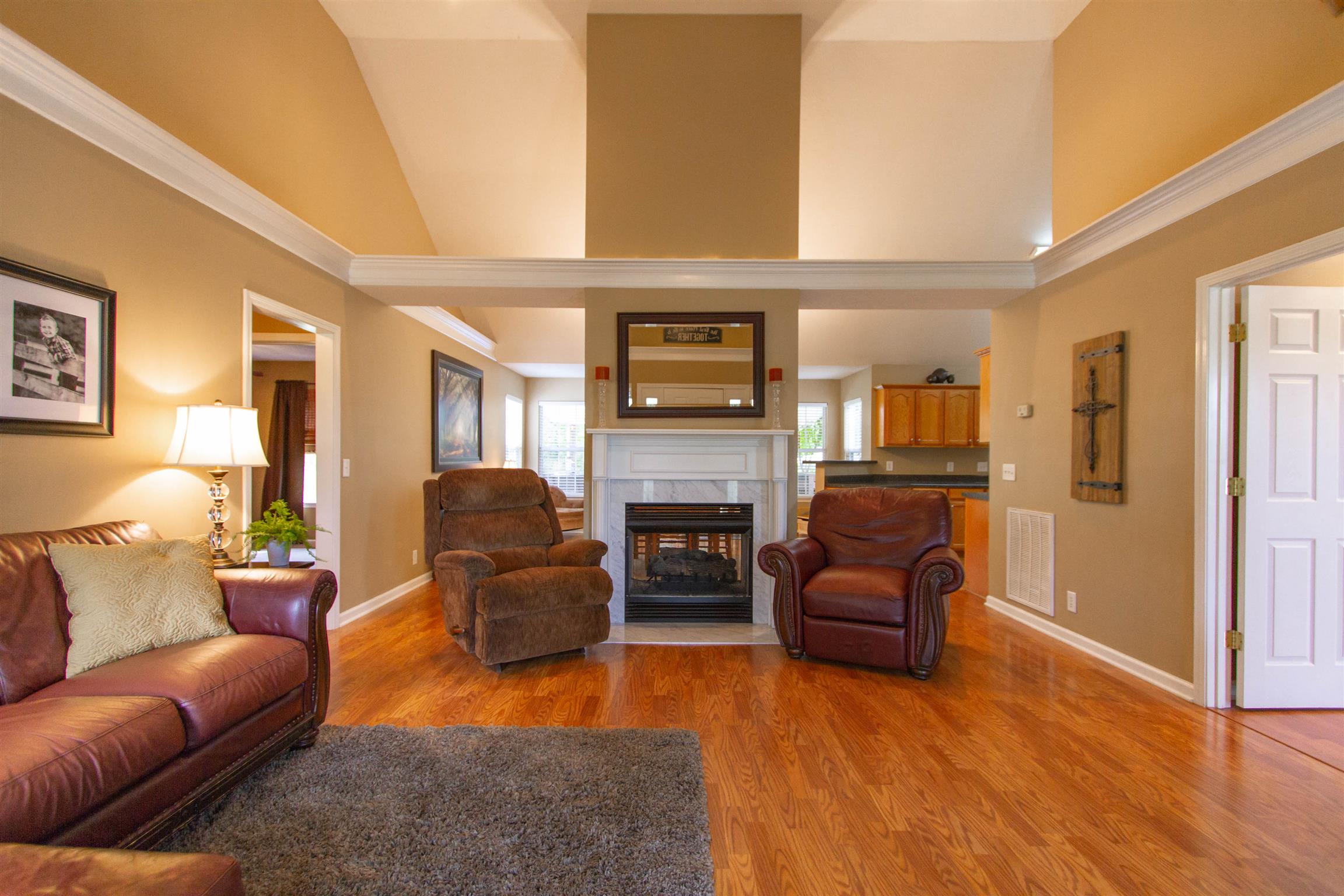 142 Switchboard Road Portland, TN 37148 - Photo 2 of 29 a living room with fireplace furniture and a wooden floor