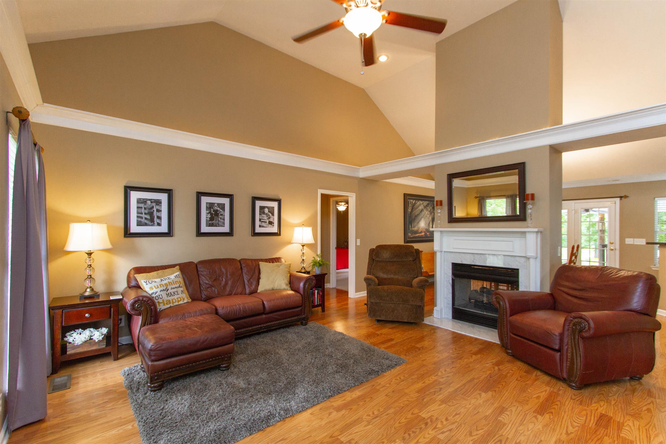142 Switchboard Road Portland, TN 37148 - Photo 3 of 29 a living room with furniture a fireplace and a flat screen tv