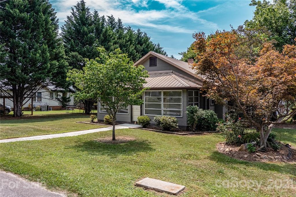 115 Myrtle Street Morganton, NC 28655 - Photo 3 of 29 a view of a house with a yard porch and sitting area