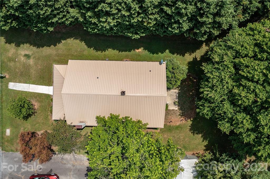 115 Myrtle Street Morganton, NC 28655 - Photo 5 of 29 an aerial view of a house with a yard and a large pool