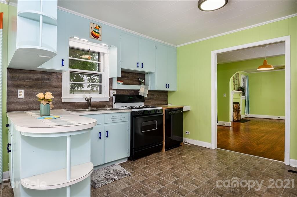 115 Myrtle Street Morganton, NC 28655 - Photo 9 of 29 a kitchen with a sink stove and microwave