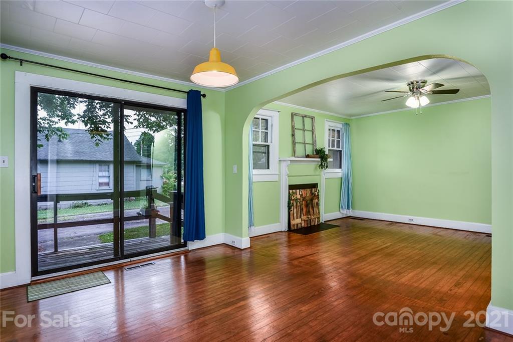 115 Myrtle Street Morganton, NC 28655 - Photo 10 of 29 wooden floor in an empty room with a window