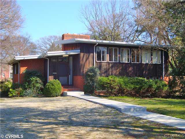 3905 Brook Road Richmond, VA 23227 - Photo 1 of 12 a front view of a house with garden
