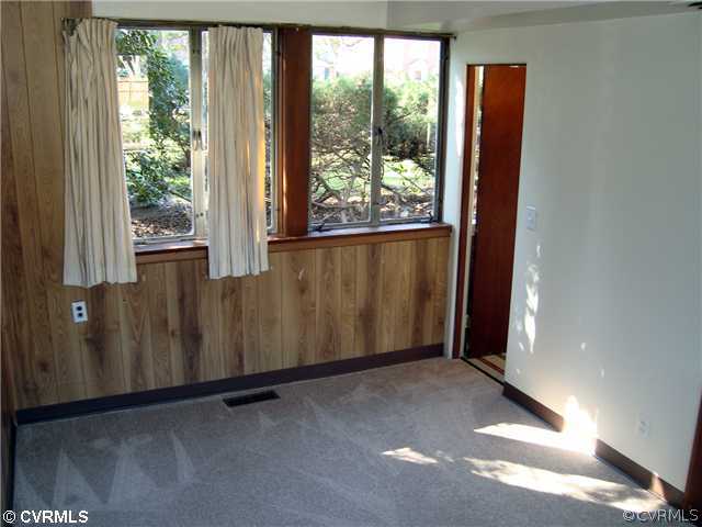 3905 Brook Road Richmond, VA 23227 - Photo 11 of 12 an empty room with wooden floor and windows