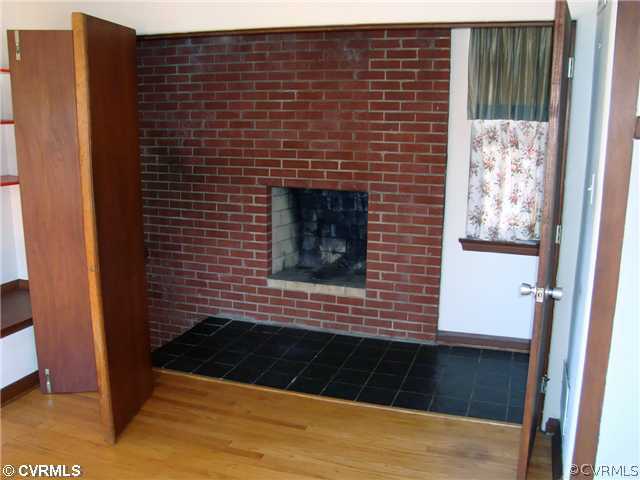 3905 Brook Road Richmond, VA 23227 - Photo 8 of 12 a view of a brick wall of the house