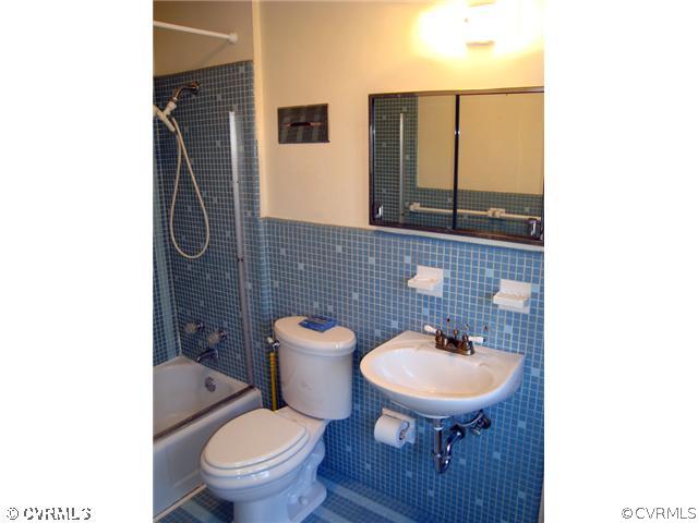 3905 Brook Road Richmond, VA 23227 - Photo 10 of 12 a bathroom with a toilet a sink and mirror