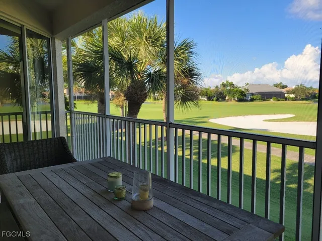 a view of balcony with wooden floor