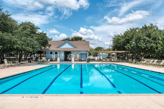 205 Polk Kyle, TX 78640 - Photo 21 of 22 Community swimming pool with lap lanes and ample deck space